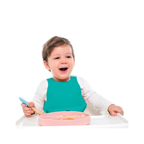 Minikoioi – śliniak silikonowy z kieszonką i zapięciem na plecach Zielony 